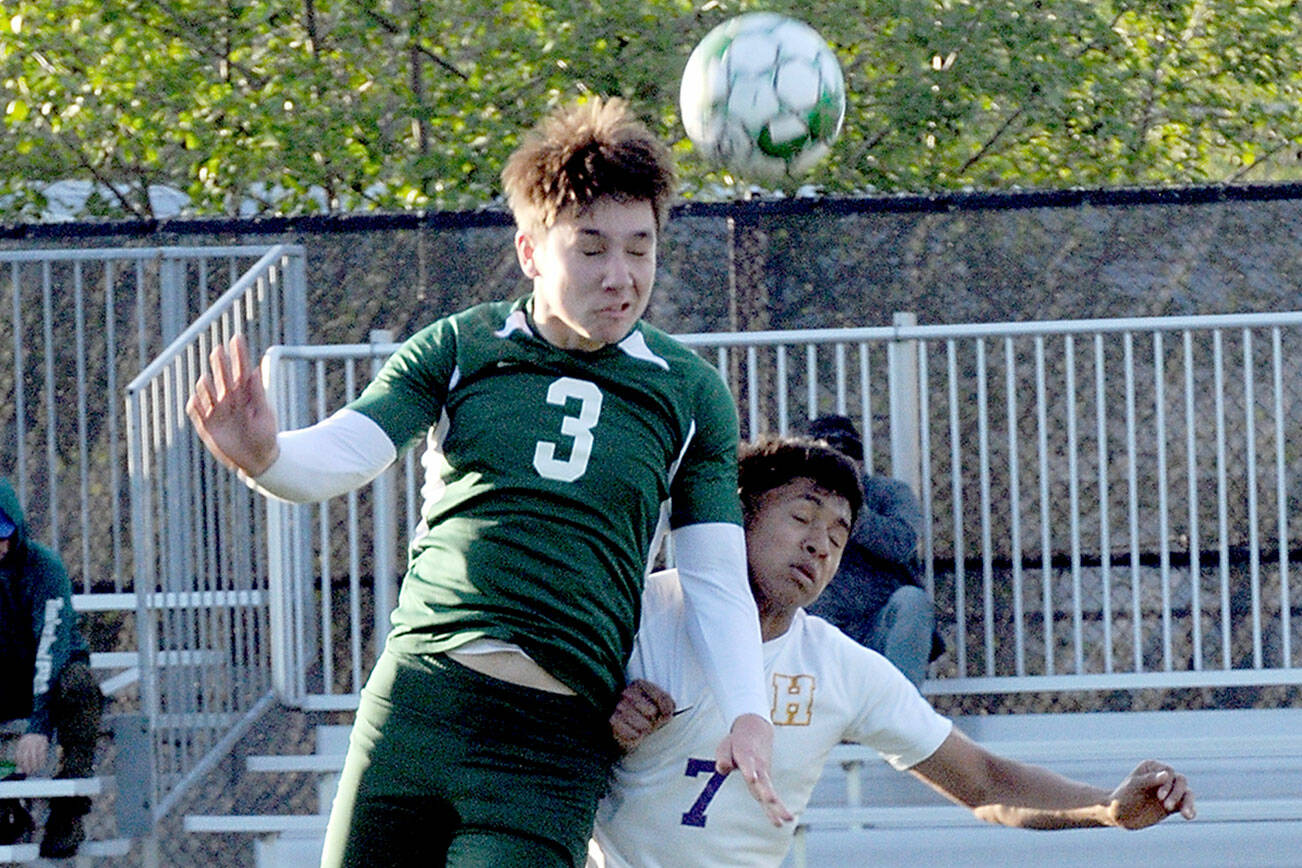 KEITH THORPE/PENINSULA DAILY NEWS
Port Angeles' Landon Close, left, goes up and over Highline's Yonatan Garcia-Arevalo on Tuesday in Port Angeles.