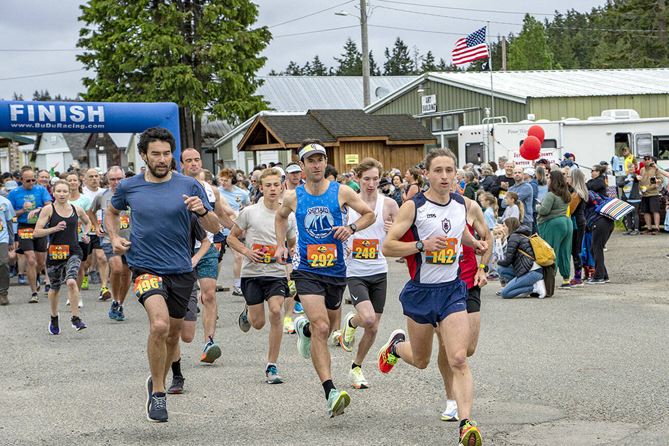 Port Townsend’s Seamus Fraser (142) is a step ahead of the rest of the nearly 1,000 competitors in the 2023 Rhody Run on Sunday at the Jefferson County Fairgrounds. Fraser had flown in from classes in Ecuador the night before in order to defend his victory from last year. Fraser won the 10K event with a time of 35 minutes, 24 seconds. (Steve Mullensky/for Peninsula Daily News)