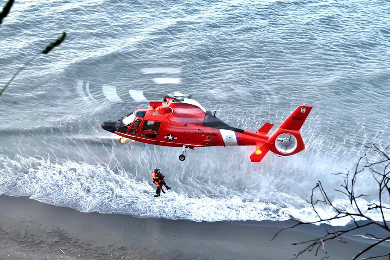 A helicopter from the Coast Guard station in Port Angeles assists in the rescue. (Clallam County Sheriff’s Office)