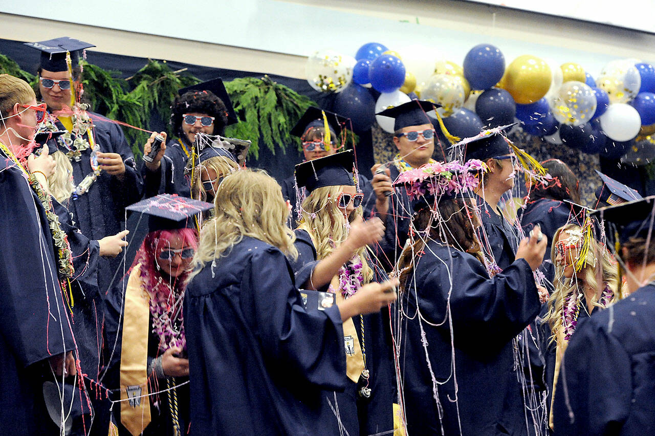 The Forks High School Class of 2023 begins to celebrate at the conclusion of the Commencement Ceremony Saturday afternoon in the Spartan Gym. (Lonnie Archibald/for Peninsula Daily News)