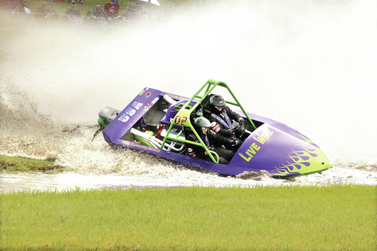 Driver Vaughan Trapp and Navigator Matt Denson of Live Wire sprint boat racing based in Sequim competed this weekend at Webb’s Slough outside of St. John, in Whitman County. Live Wire made it to the final eight in both the 800 and unlimited classes of the jet sprint boat races. Sprint boat racing returns to the Extreme Sports Park west of Port Angeles on July 29-30 and Sept. 9-10. (Olivia Harnack/Whitman County Gazette)