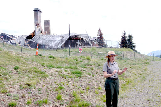 Olympic National Park Superintendent Sula Jacobs talks about the fire from a vantage point just below the day lodge, which burned May 7. (Dave Logan/for Peninsula Daily News)