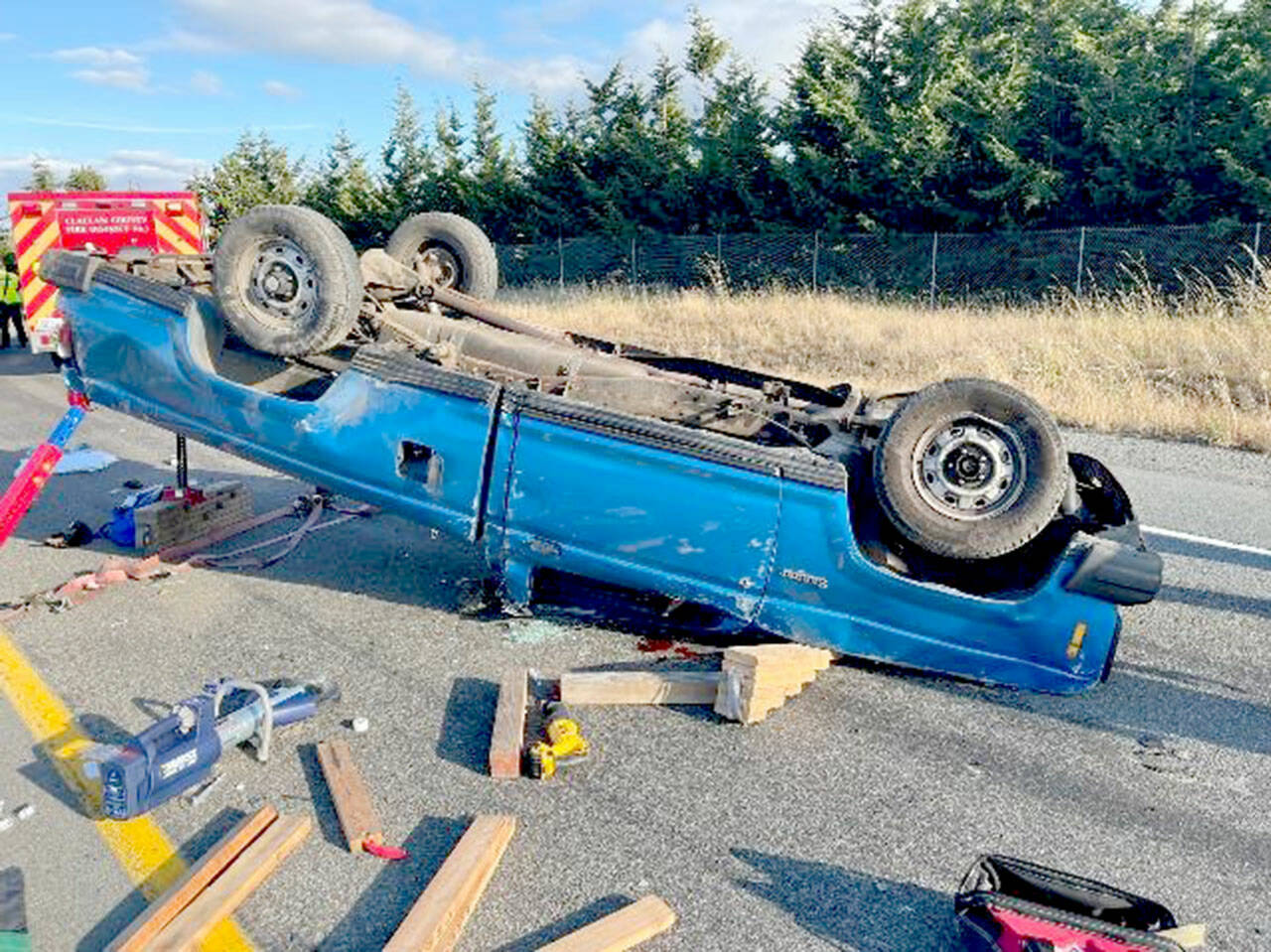 A 1983 Ford Ranger blocks the eastbound exit off Highway 101 at River Road in Sequim on Monday after the driver lost control of the vehicle. The driver, a 26-year-old Port Hadlock man, was airlifted to Harborview Medical Center in Seattle. (Courtesy photo/Clallam County Fire District 3)