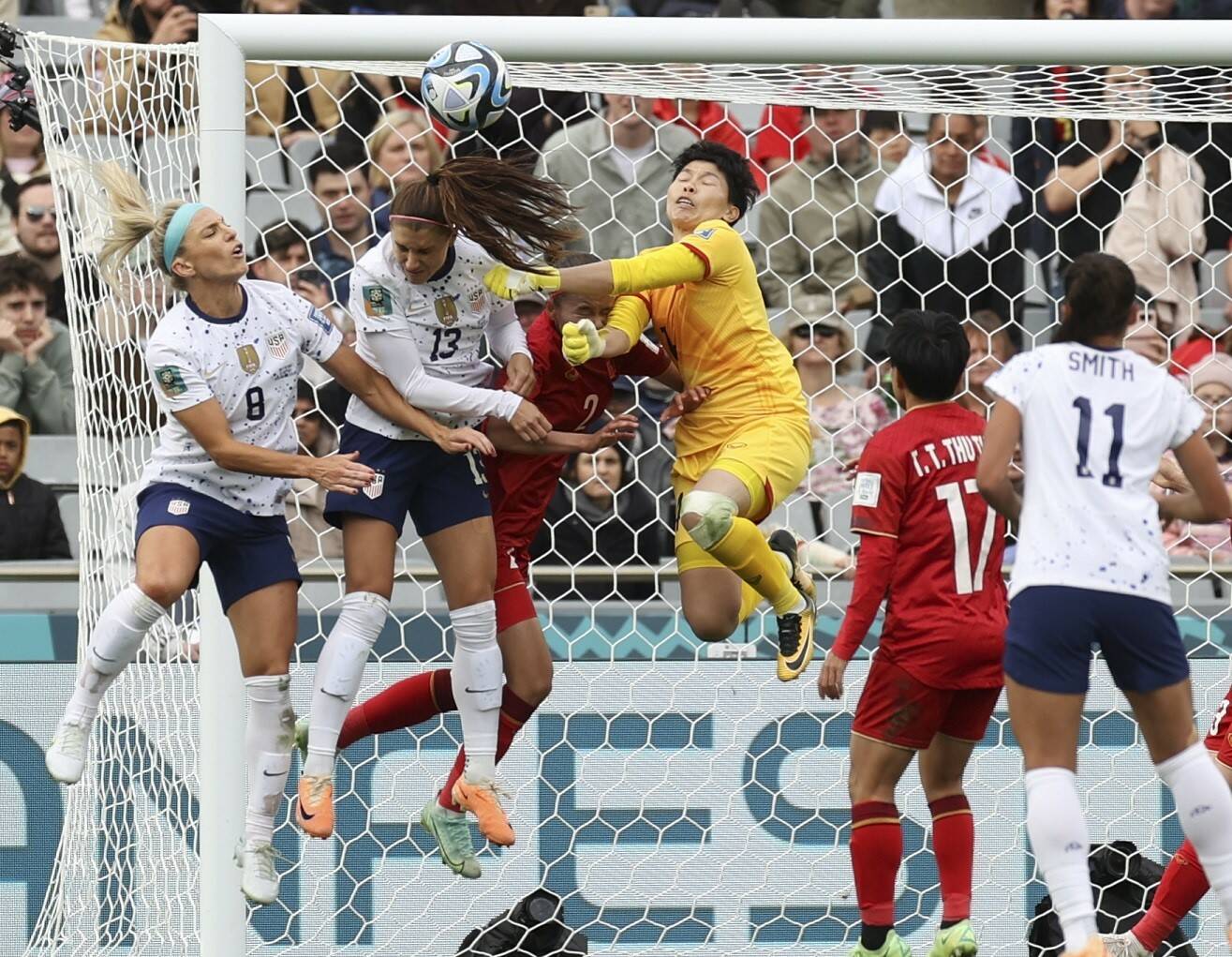 From left, United States' Julie Ertz, United States' Alex Morgan and Vietnam's goalkeeper Thi Kim Thanh Tran collide during the Women's World Cup Group E soccer match between the United States and Vietnam in Auckland, New Zealand on Saturday. (AP Photo/Rafaela Pontes)