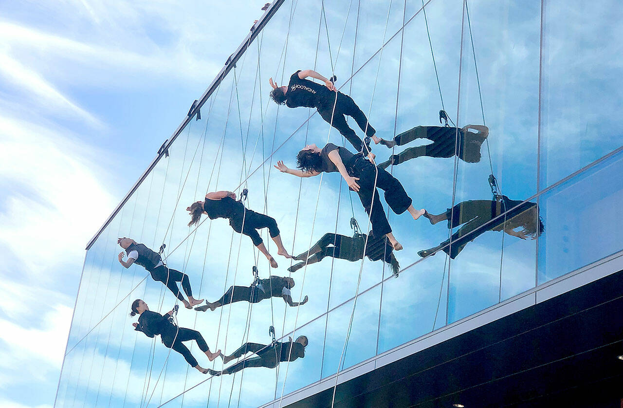 Members of the BANDALOOP vertical dance troupe practice a routine on the side of the Field Arts & Events Hall in Port Angeles on Wednesday. The group will take part in the venue’s official grand opening celebration this weekend with three free public performances on Saturday at noon, 6 p.m. and 7:30 p.m. For more about the grand opening weekend, see Page A4. (Keith Thorpe/Peninsula Daily News)