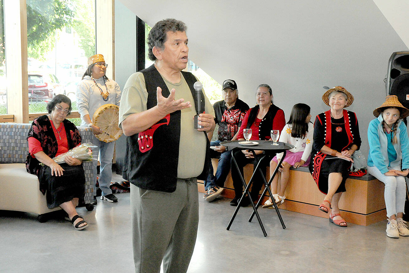 KEITH THORPE/PENINSULA DAILY NEWS
Lower Elwha Klallam artist and storyteller Robert Fernandes, who served as curator of the Field Arts & Events Hall gallery collection of Klallam art works and crafts, speaks about the collection during Thursday night's gallery opening and reception in Port Angeles. The showing has the title "Creations by the Klallam People."