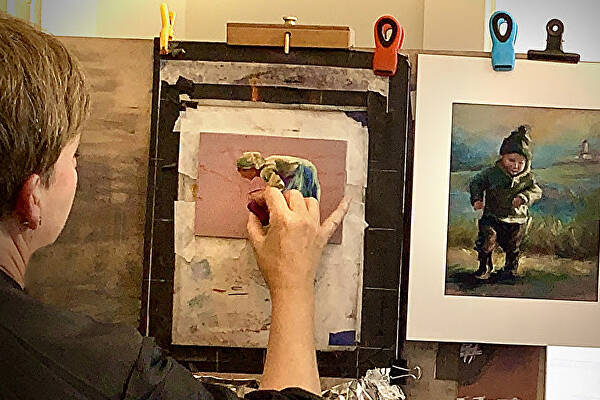 Photo courtesy of Anne Milligan / Sequim artist Anne Milligan works on a piece in her studio at 520 N. Sequim Ave.