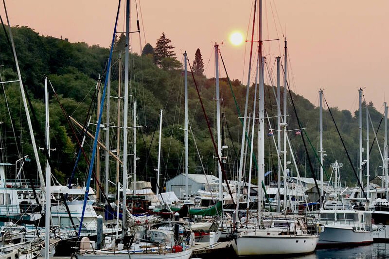 A smoky haze seen from Port Angeles Boat Haven from wildfires in eastern Washington and Canada affected air quality in the North Olympic Peninsula on Sunday. The National Weather Service said Monday that westerly winds should help clear out the smoke and lead to clear conditions. (Dave Logan/for Peninsula Daily News)