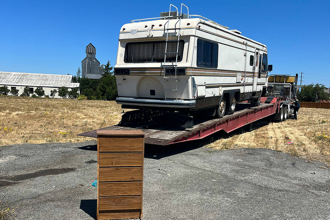 In mid-July, an RV parked partially on public and private property was towed at the request of the City of Sequim after it was deemed abandoned after 18 months parked in one spot. It’s one of a handful of RVs and vehicles illegally parked in the City of Sequim as nonprofit agencies seek safe housing options for residents. (Michelle Ridgway)