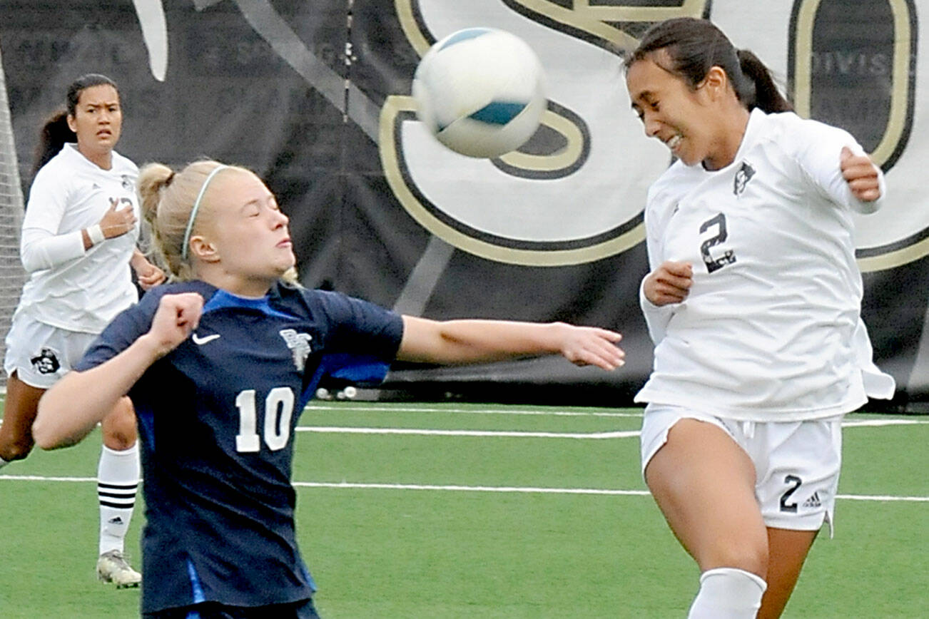 KEITH THORPE/PENINSULA DAILY NEWS
Peninsula's Briana-Jean Tanaka, right, leaps for a header in front of Bellevue's Giulia Menning on Saturday at Peninsula College in Port Angeles. Looking on from behind is Tanaka's teammate Keilee Silva.