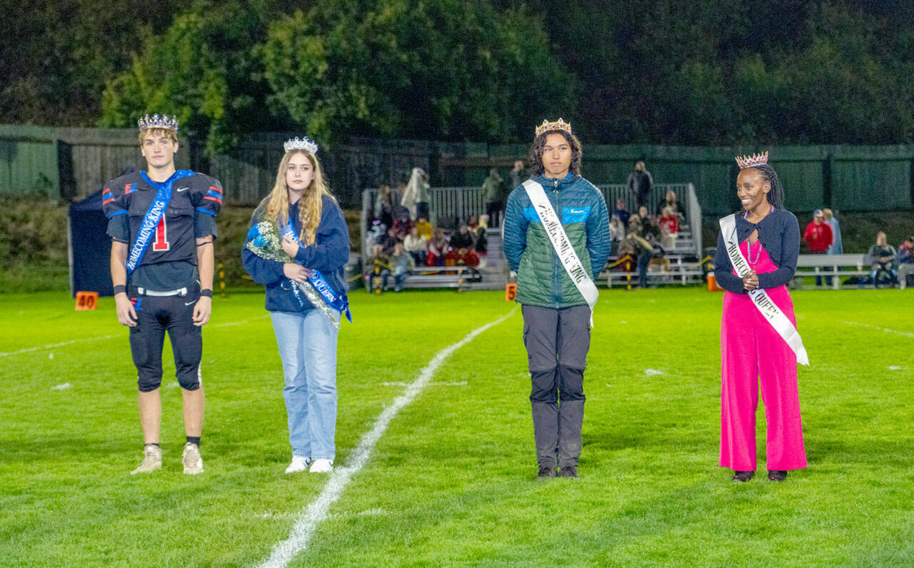 Homecoming Royalty are, from left, Chimacum High School King Gary Zambor and Queen Julia Breitweg, and Port Townsend High School King Ken Llotse-Rowell and Queen Tadu Dollarhide as they were introduced to the spectators at Memorial Field in Port Townsend on Friday. (Steve Mullensky/for Peninsula Daily News)