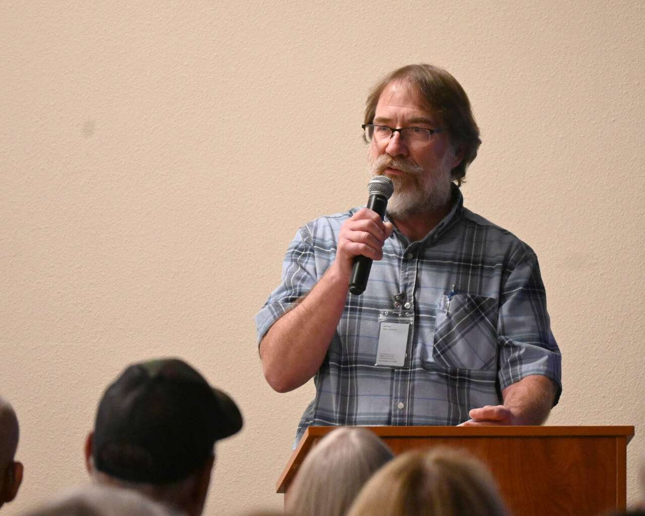 Joe Donisi, an engineer with the Clallam County Road Department, gives details on the four options of the lower Dungeness levee at a public meeting in Sequim. (Michael Dashiell/Olympic Peninsula News Group)