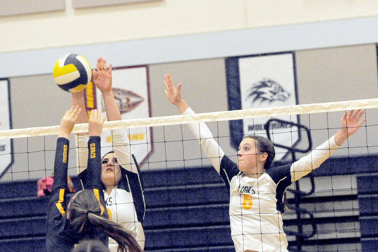 Spartans Kaidance Rigby (left) and Chloe Gaydeski compete at the net with Ilwaco’s Alycia Figueroa Thursday evening in the Spartan Gym where Forks defeated the Fisherman 25 to 18, 25 to 17 and 25 to 13 in this league contest. Photo by Lonnie Archibald.