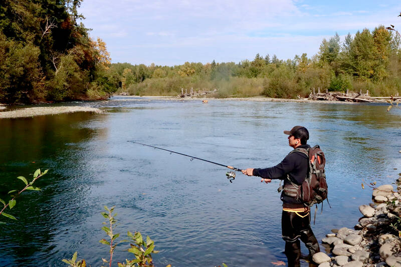 Dancen Charles, a member of the Lower Elwha Klallam Tribe, fishes the Elwha River, which is open only to tribal fishermen. A quota of 400 fish can be taken by pole and later by netting, with future quotas determined by the Northwest Indian Fisheries Commission. (Dave Logan/for Peninsula Daily News)