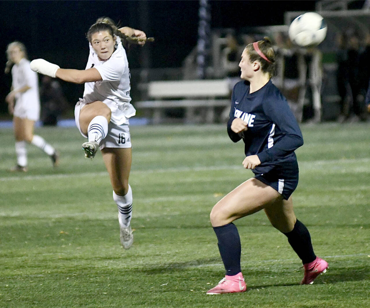 Shawna Larson (16), playing with a broken hand, gets off a shot Friday night in the NWAC semifinals. (Jay Cline/Peninsula College)