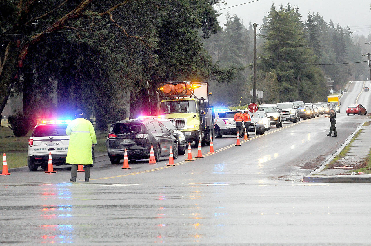 Traffic backs up on Monroe Road because of an automobile wreck near the intersection with U.S. Highway 101 on Thursday. (Keith Thorpe/Peninsula Daily News)