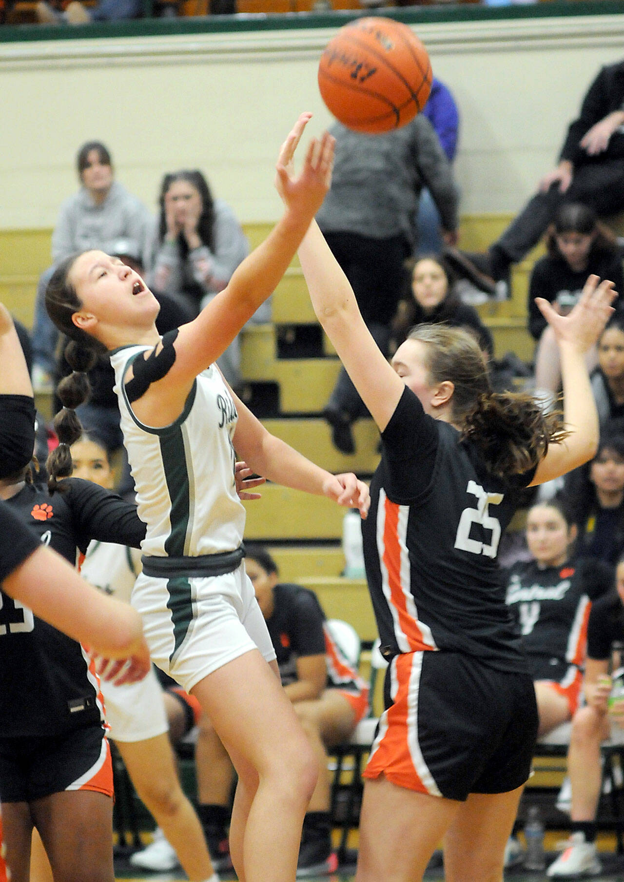 Port Angeles’ Lindsay Smith puts up a shot over the head of Central Kitsap’s Sonora Manchester on Saturday evening at Port Angeles High School. (Keith Thorpe/Peninsula Daily News)