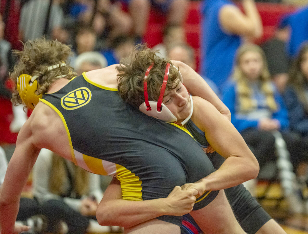 East Jefferson’s Grady White, white ear protectors, takes down Vashon’s Michael Ryland during the East Jefferson Invitational held Saturday at Port Townsend. (Steve Mullensky/for Peninsula Daily News)