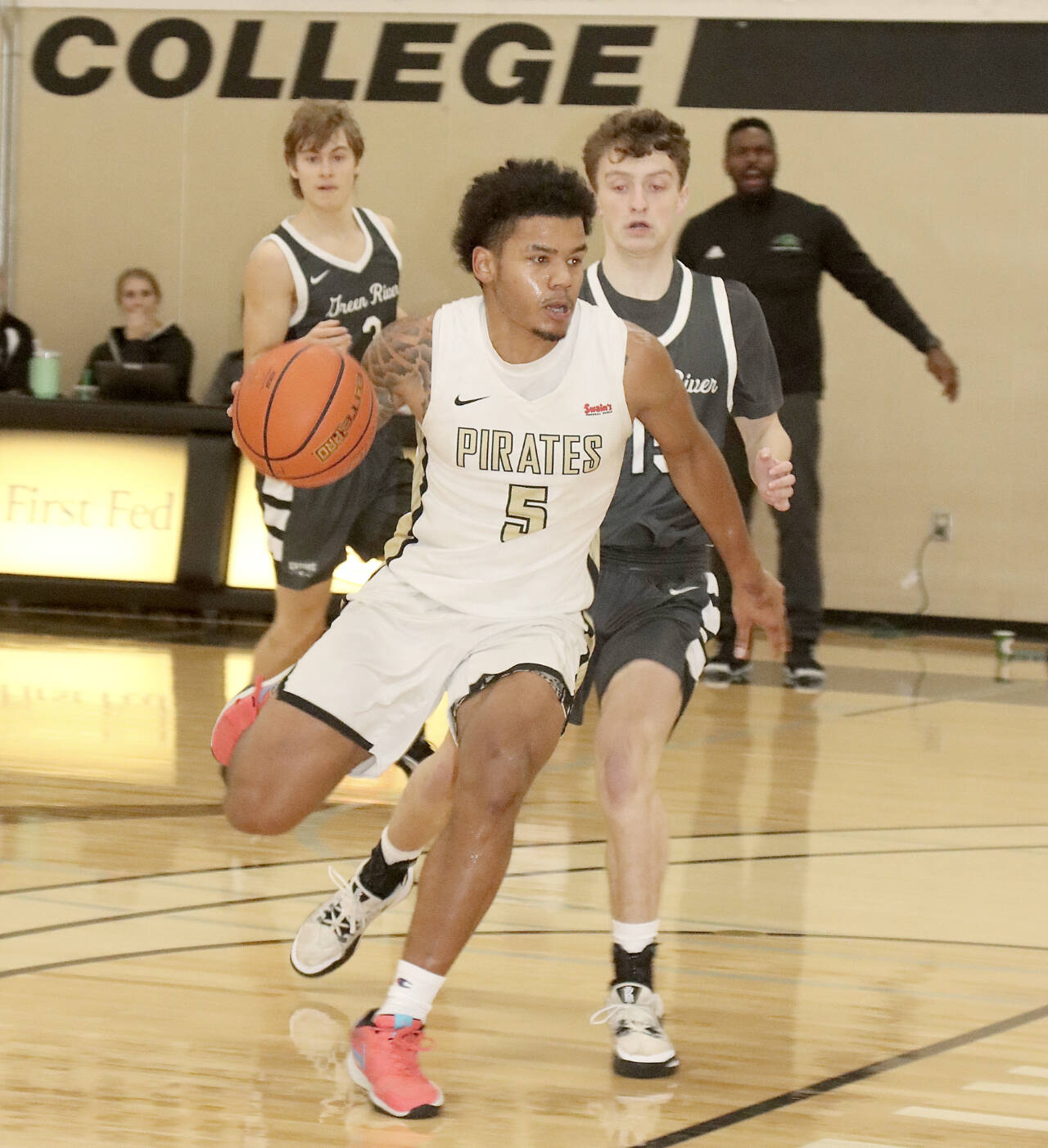 Peninsula College’s Javon Ervin (5) drives the ball against Green River on Saturday in Port Angeles. Green River won 78-58. (Dave Logan/for Peninsula Daily News)