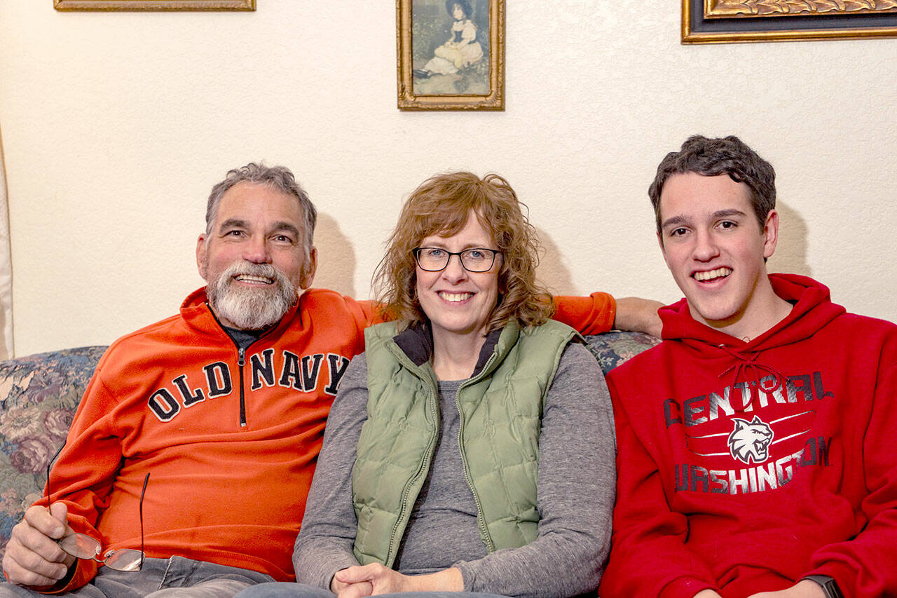 The McKenzie family, Ian, Lori and son Joshua, at home in Port Townsend on Thursday. (Steve Mullensky/for Peninsula Daily News)