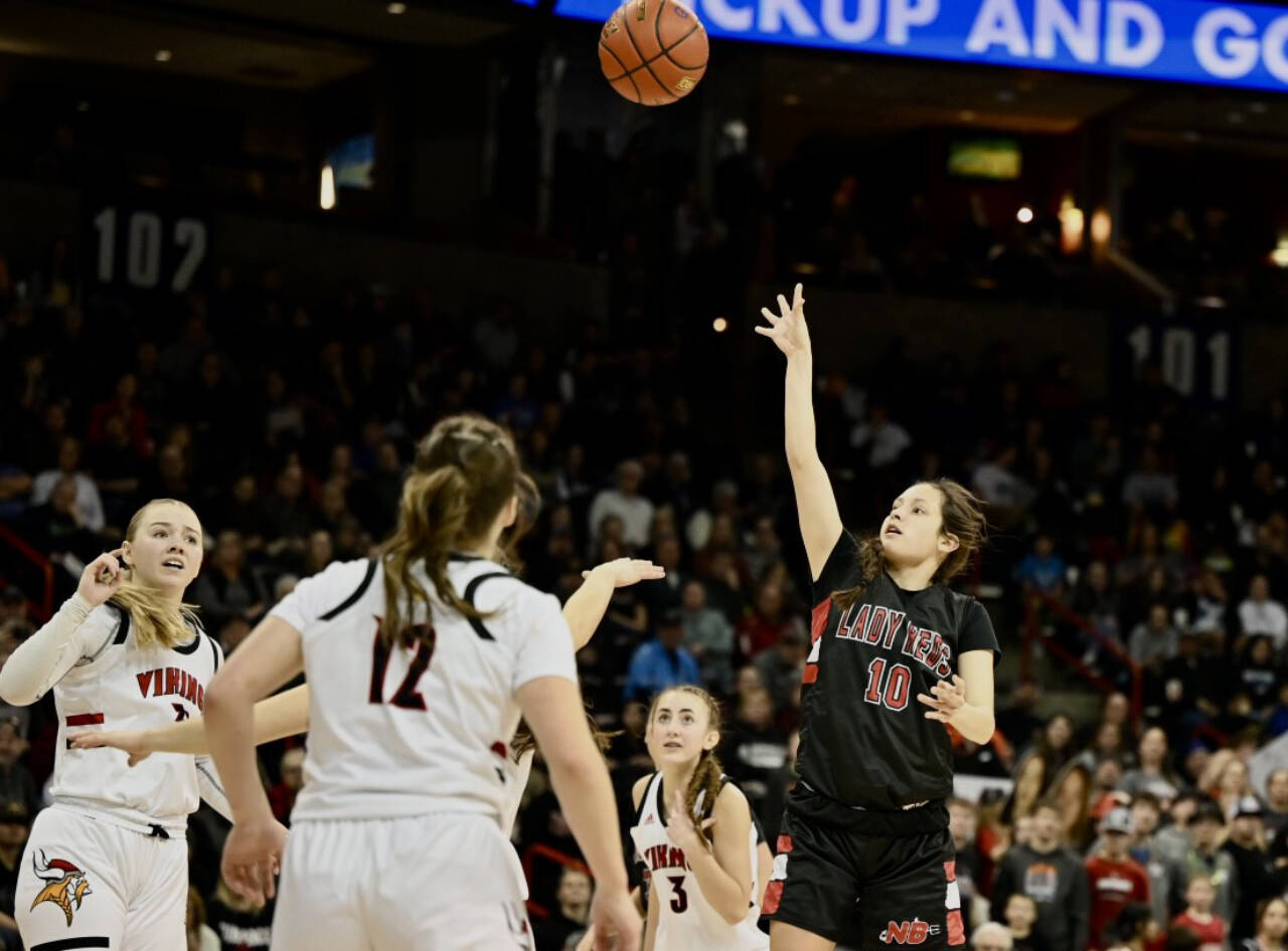 Neah Bay’s Allie Greene shoots over the Mossyrock defense on March 4 in Spokane in the 1B state championship game. Greene led the Red Devils with 19 points to help the Neah Bay girls win the state championship 56-54. She now plays for Peninsula College. (Bridget Mayfield/for Peninsula Daily News)