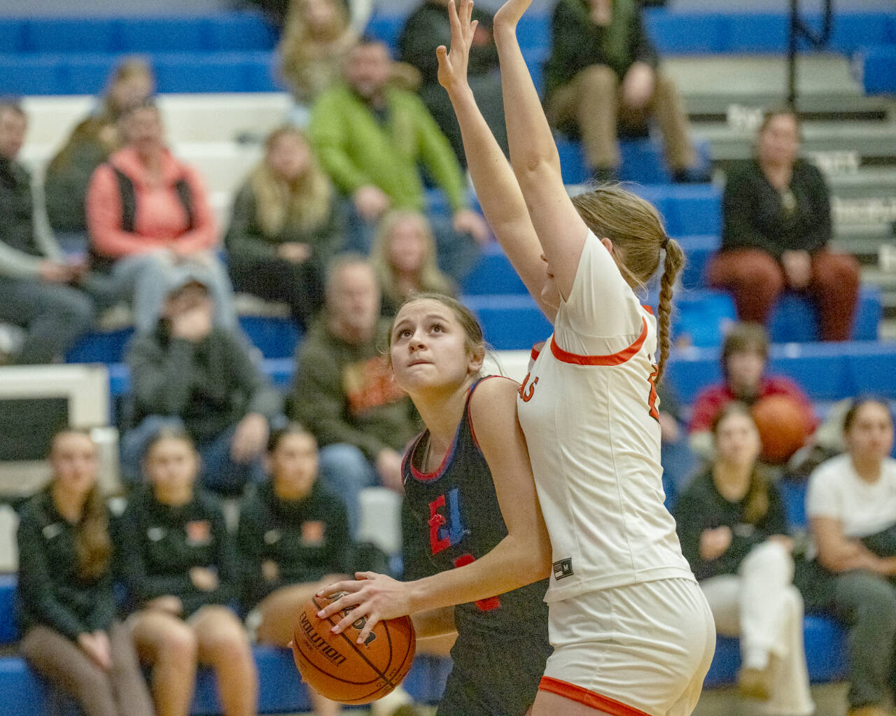 East Jefferson’s Kateyn Riley keeps her eyes on the basket while being closely guarded against Washougal on Saturday in Chimacum. (Steve Mullensky/for Peninsula Daily News)