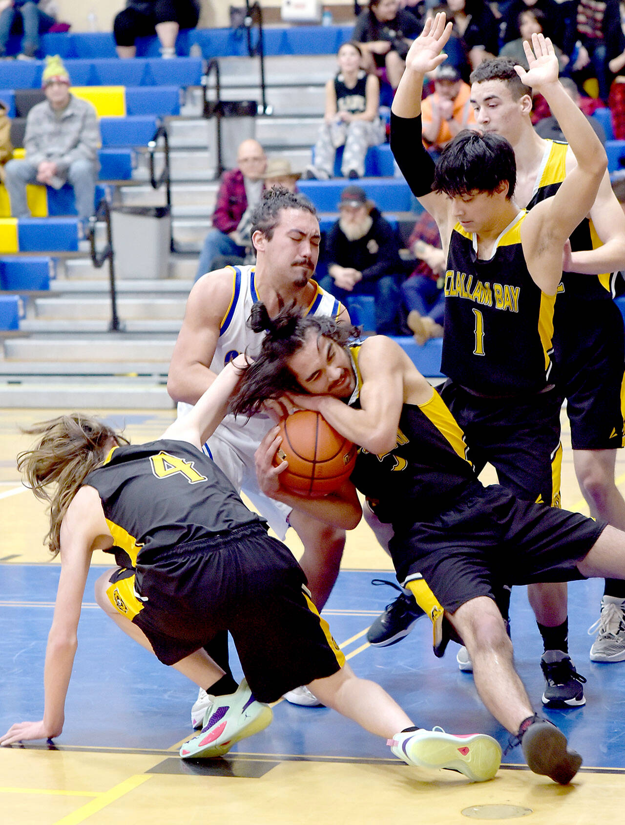 Crescent’s Peyton Watson fights for the ball with Clallam Bay’s Parker Prater, center, as Prater’s teammates, from left, Dylan Simmons, Mauncio Cruz-Lopez and William Hull try to avoid the fray on Tuesday night in Joyce. (Keith Thorpe/Peninsula Daily News)