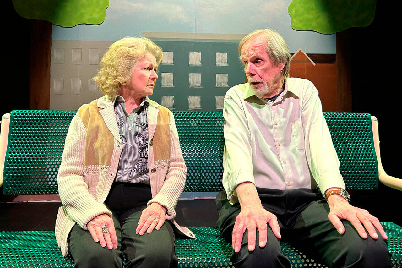 Carol and Ralph, played by Sharon DelaBarre and Pat Owens, share a tender moment speaking about their spouses in a dog park bench in Olympic Theatre Arts’ “The Last Romance.” (Matthew Nash/ Olympic Peninsula News Group)