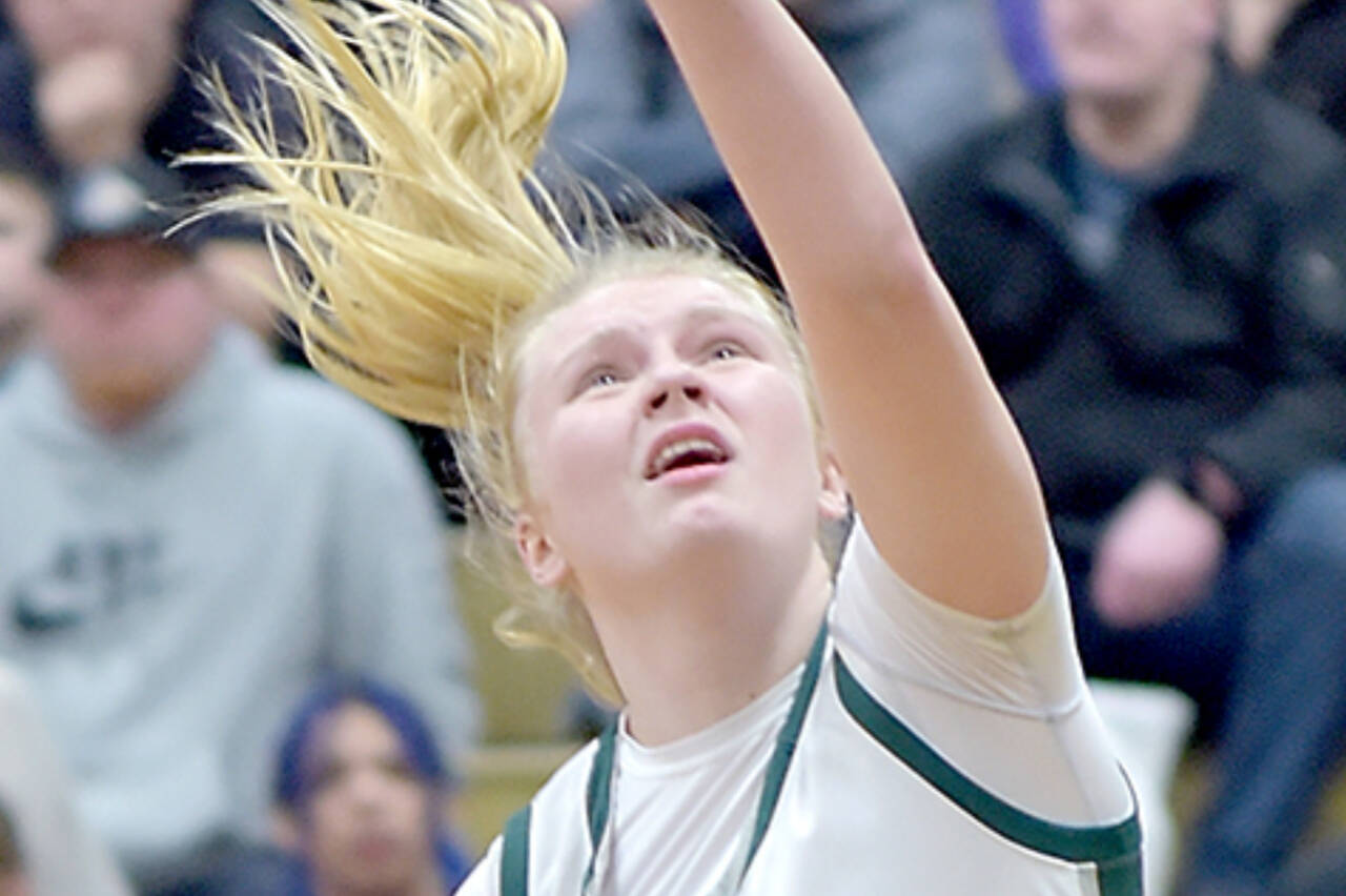 Port Angeles’ Paige Mason, right, shoots against Sequim on Feb. 6. She scored 26 points in the Port Angeles victory and is the Peninsula Daily News Athlete of the Week sponsored by Swain’s General Store in Port Angeles. (Keith Thorpe/Peninsula Daily News)