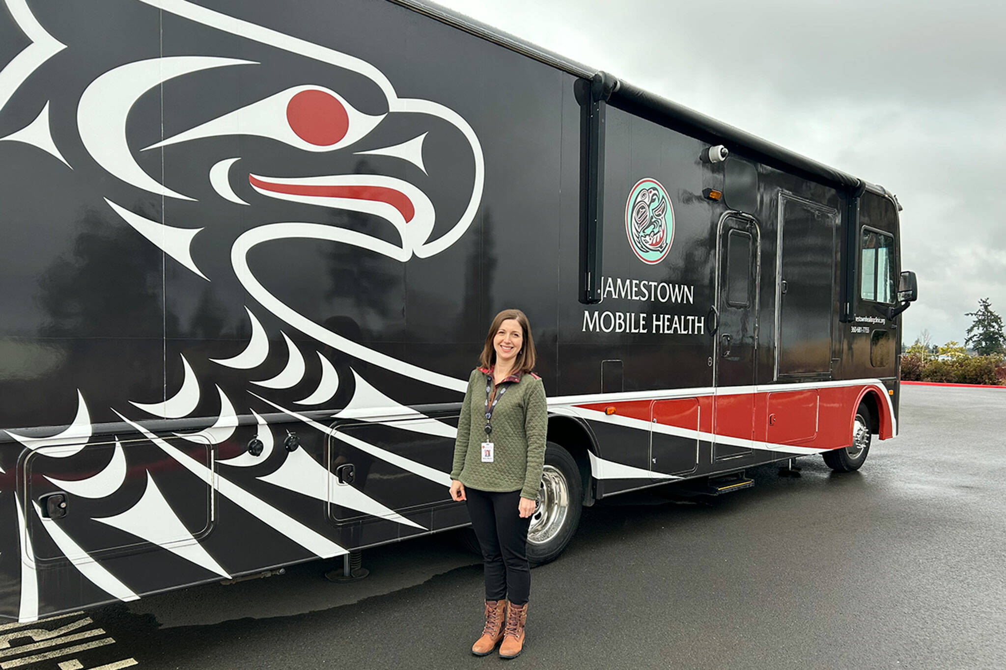 Molly Martin, executive director of the Jamestown Healing Clinic, stands by the clinic’s new mobile medical unit that will offer medication-assisted treatment and wrap-around services in Clallam Bay on weekdays. (Matthew Nash/Olympic Peninsula News Group)