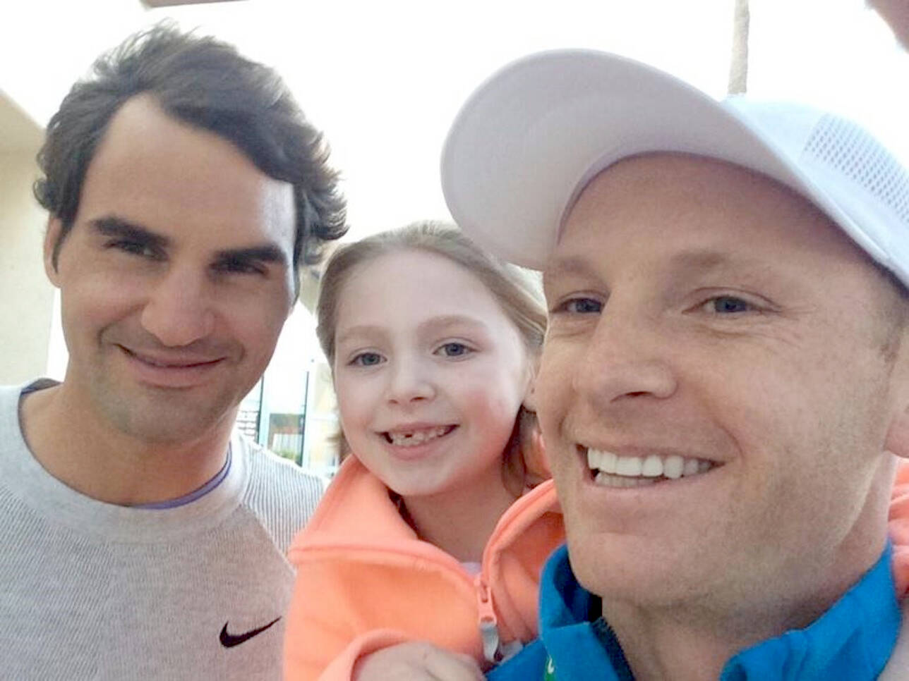 Courtesy photo
Port Angeles tennis star Jesse Schouten, at right, with his daughter and tennis legend Roger Federer.