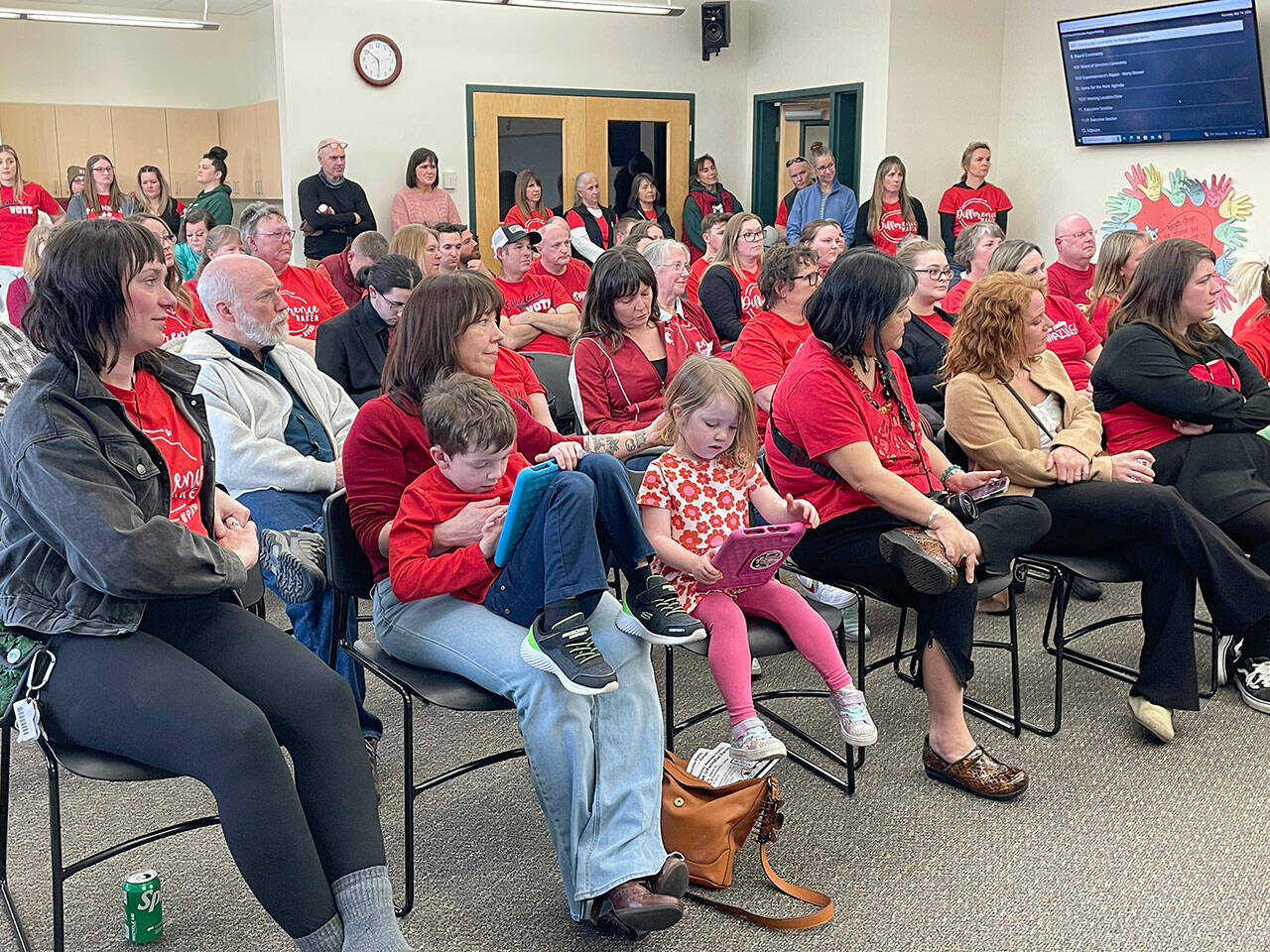 More than 100 educators appeared at Thursday’s Port Angeles School District board meeting to show their support for paraeducators, who are seeking a 3.7 percent pay raise and have been working without a contract since Aug. 31. (Paula Hunt/Peninsula Daily News)