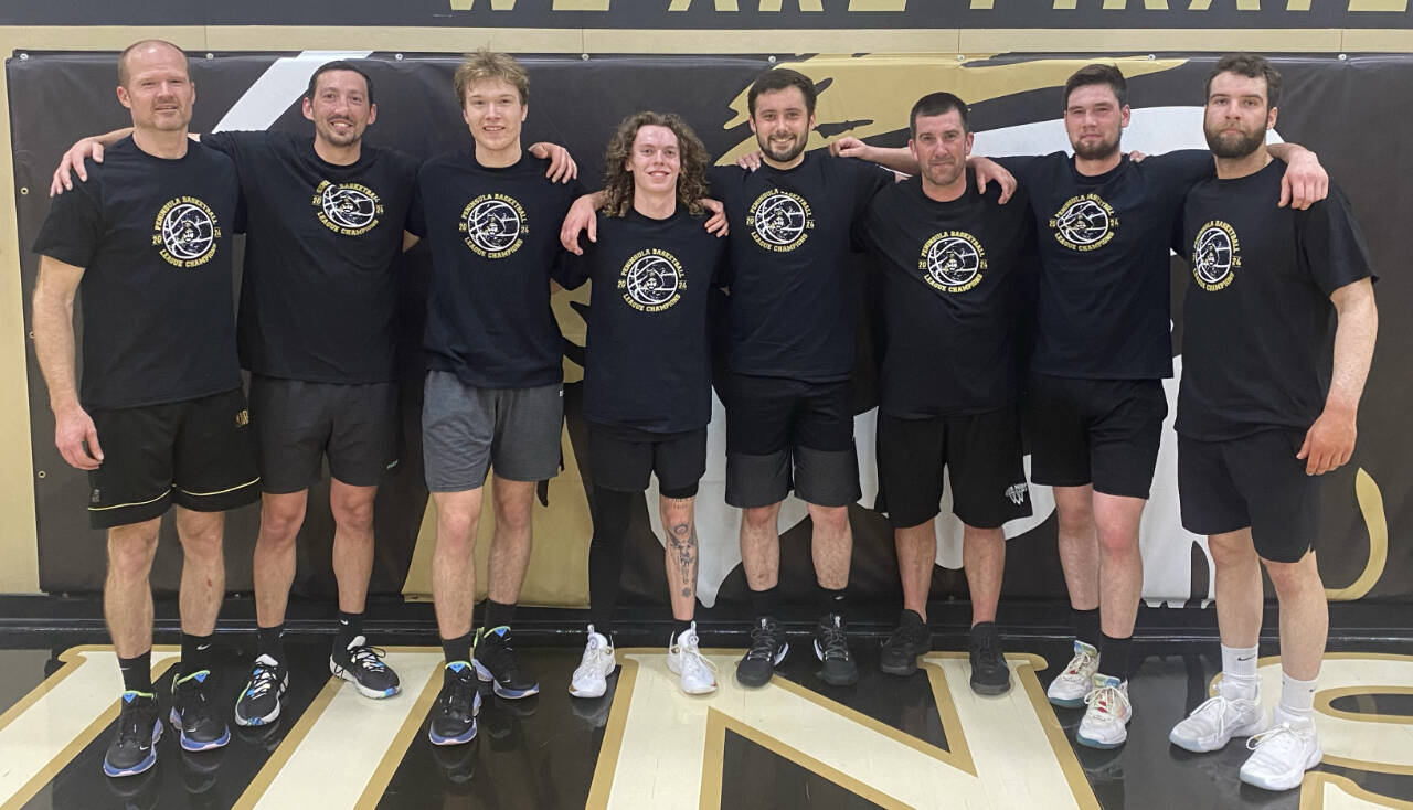 Members of 7 Cedars celebrate a Peninsula Basketball League title on March 17. Pictured are (from left) Jim Halberg, Dan Horton, Andrew Halberg, Dru Clark, Kyle Benedict, team captain Kasey Ulin, Gabe Long and Garrett Edwards.