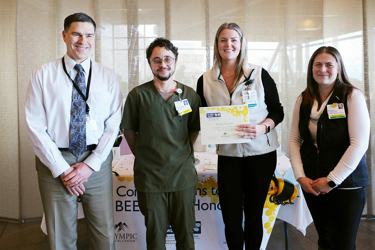 Pictured, from left, are OMC CEO Daryl Wolfe, Reuben May, Megan Reader, the supervisor of the specialty clinic, and Emily Fry.