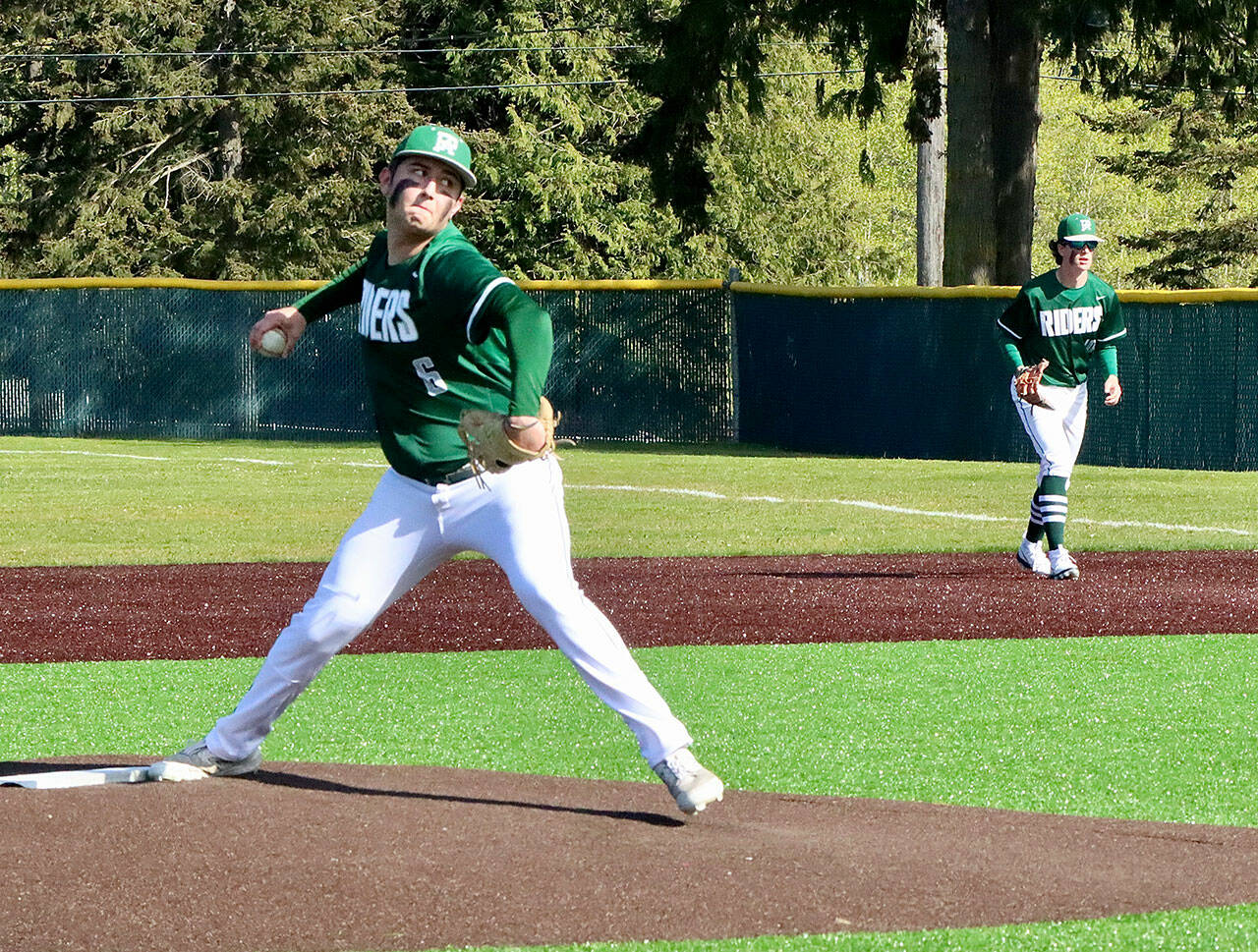 Colton Romero pitches to Bainbridge Monday afternoon at Volunteer Field. Playing first is Rylan Politika, who later came in to pitch. Romero and Politika allowed just five hits in a 5-4 Port Angeles win. (Dave Logan/for Peninsula Daily News)