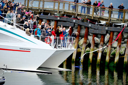 Government officials applaud the ribbon cutting at the Point Hudson breakwater in Port Townsend on Wednesday afternoon. (Diane Urbani de la Paz/For Peninsula Daily News)