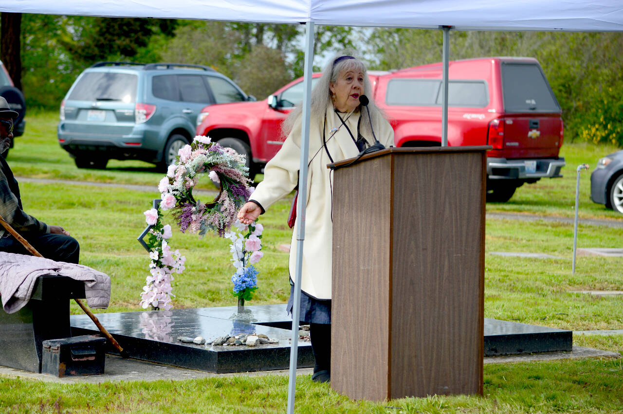 Poet Tess Gallagher, with many fellow writers and readers gathered at Raymond Carver’s grave Saturday during the Raymond Carver Tess Gallagher Creative Writing Festival. The event celebrated the works of Carver, who lived the final 10 years of his life in Port Angeles, Gallagher, who was born and raised there, and a cadre of visiting writers. (Diane Urbani de la Paz/For Peninsula Daily News)