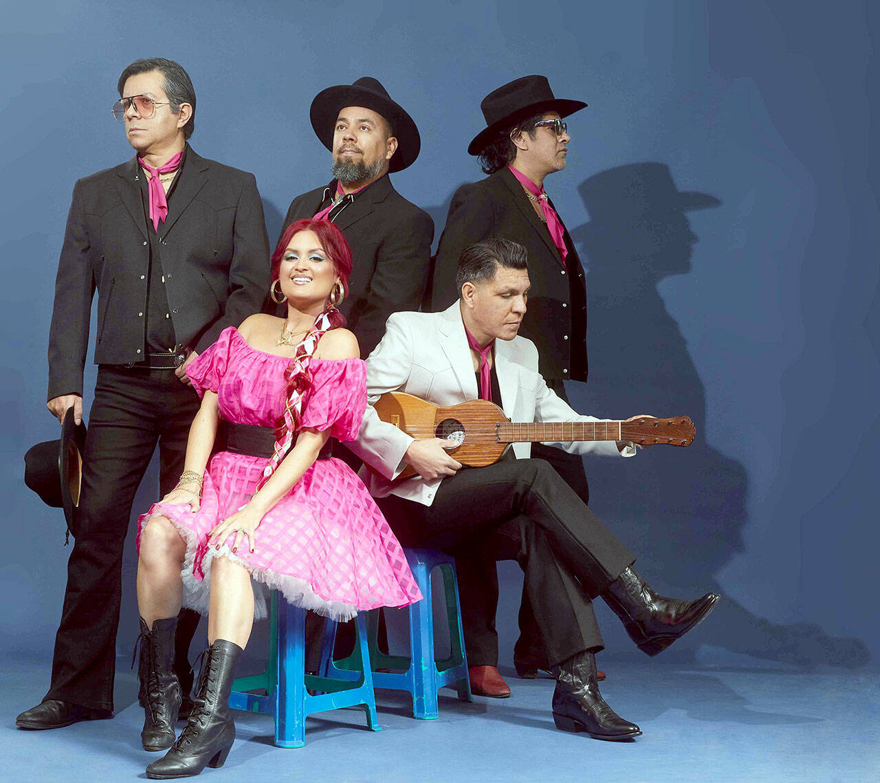 Hector Flores, seated at right, and his band Las Cafeteras are coming to Field Arts & Events Hall on Saturday night. (photo by Yulissa Mendoza)