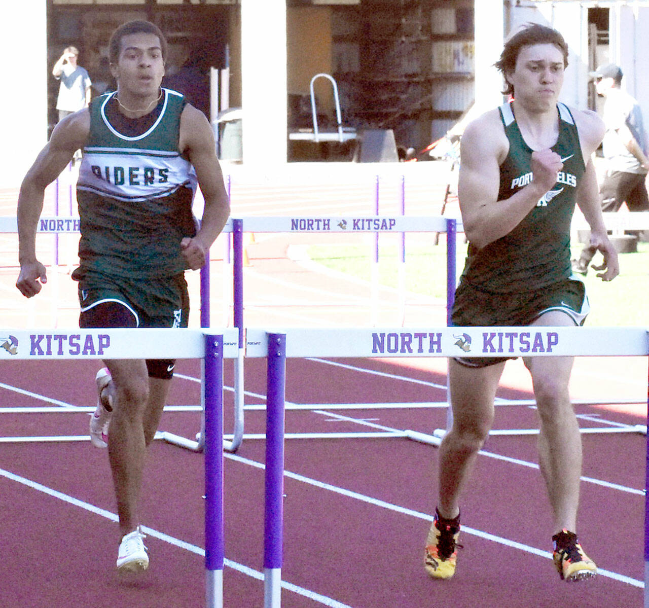 Nicholas Zellar-Singh/Kitsap News Group Port Angeles’ Donovan Heins, left, and Parker Nickerson run in the 110-meter hurdles Thursday at the Olympic League Track and Field Championship at North Kitsap High School. Nickerson won both the 100 and the 300 hurdles while Heins won the long jump Saturday with the No. 1 distance in the entire state.