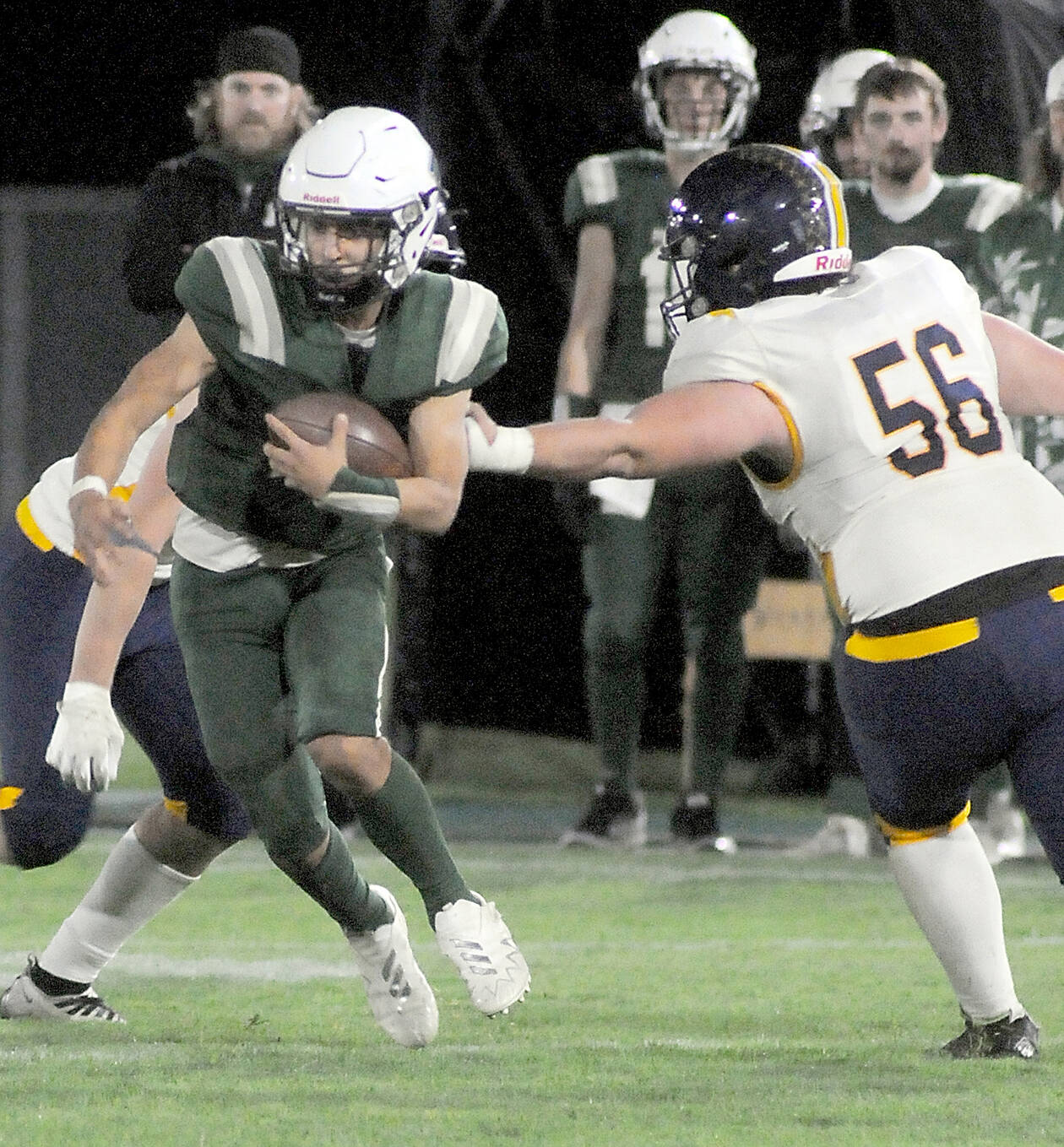 KEITH THORPE/PENINSULA DAILY NEWS 
Port Angeles’ Kason Albaugh runs with the ball during an October 2023 contest.The Riders would have a different playoff foe under the “Round of 32” district crossover plan to take effect this fall.