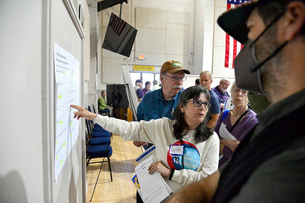 Terrie Comstock of Port Townsend asks questions about a display at the city’s kickoff meeting for its 2025 Comprehensive Plan update at the Marvin G. Shields Memorial Post 26 American Legion Hall on Thursday. The meeting was the first in a series for the update, due at the end of 2025 and required by state law. (Peter Segall/Peninsula Daily News)