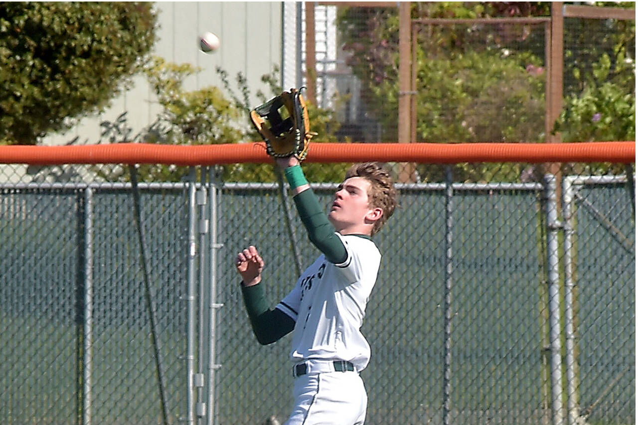 Port Angeles centerfielder Nathan Basden catches a high popup during Tuesday’s playoff against Fife in Port Angeles. Basden had a clutch two-run single to help beat Steilacoom 3-2 on Saturday in the bidistrict third-place game. (KEITH THORPE/PENINSULA DAILY NEWS)