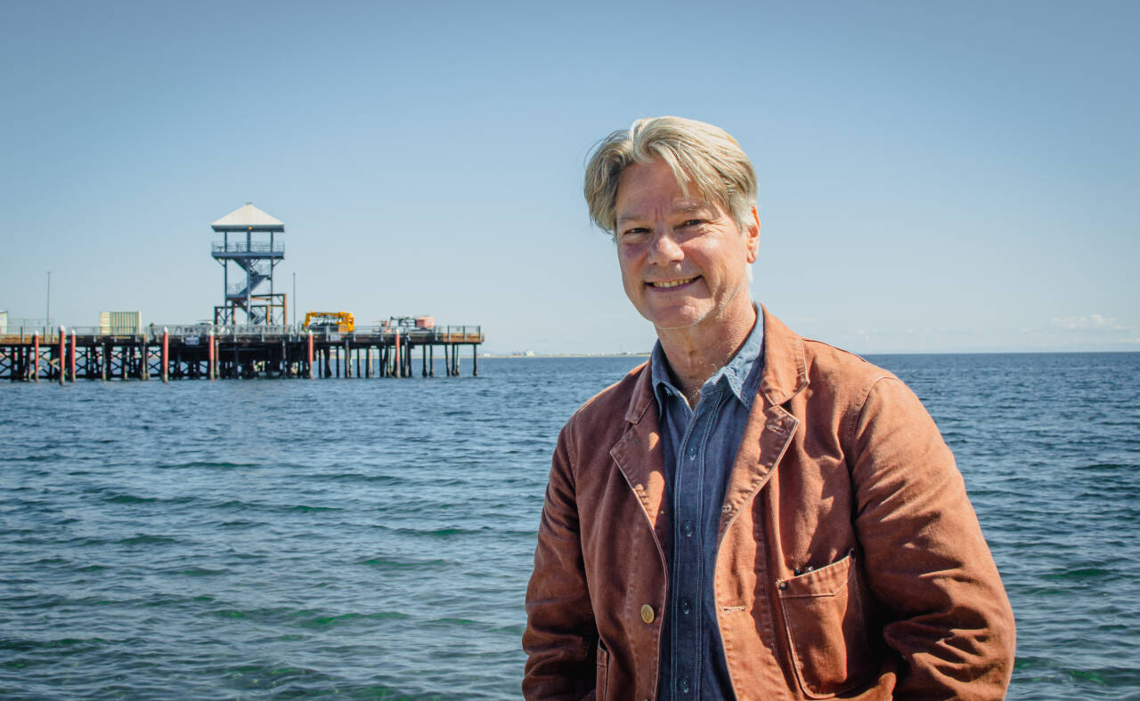 Author John Vaillant stands in front of the iconic tower at Port Angeles City Pier. (Elijah Sussman/Olympic Peninsula News Group)