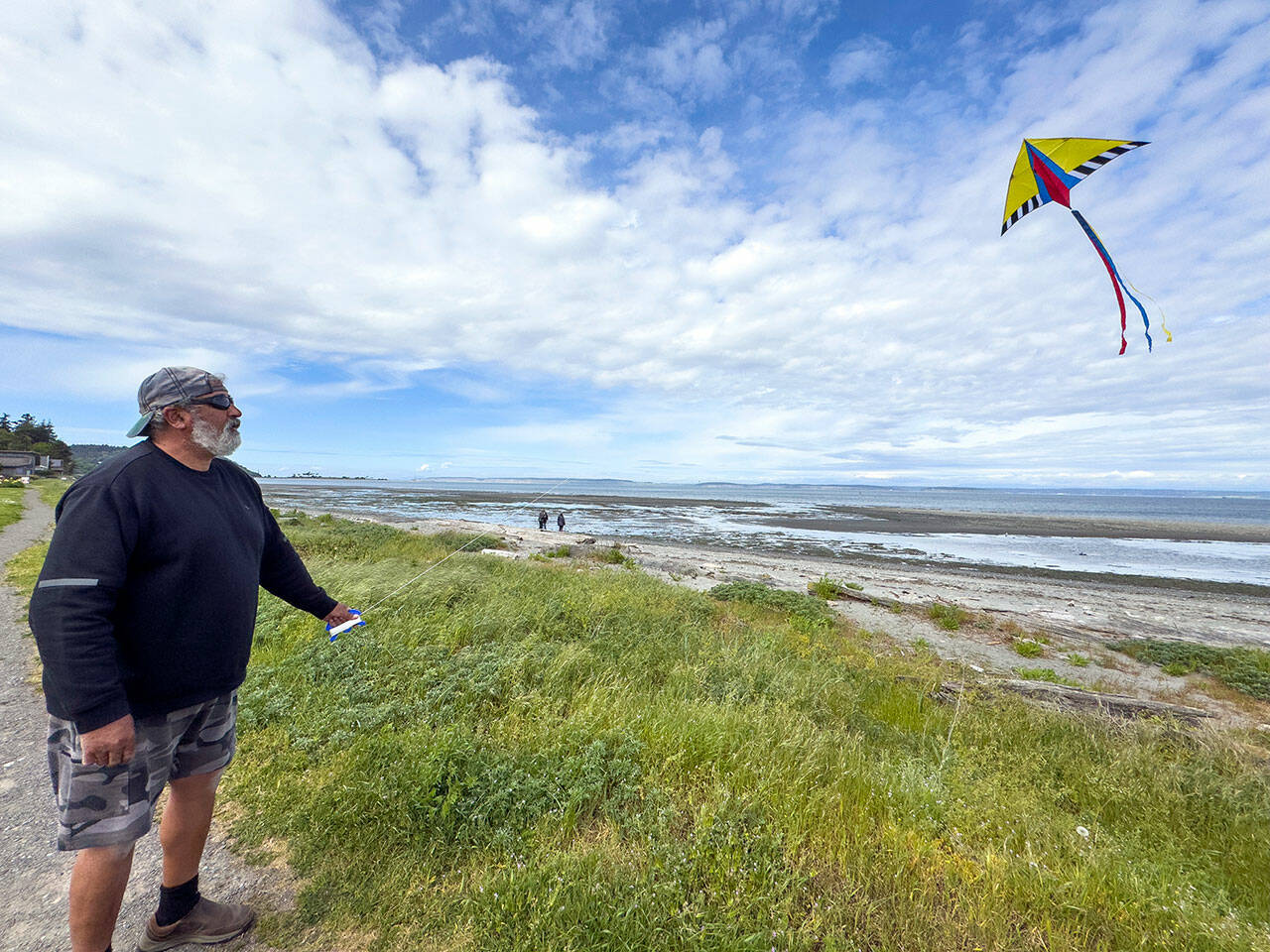 Michael Anderson of Gibsons, British Columbia tries his hand at flying a kite in the gusty winds of Point Hudson on Monday afternoon. Anderson was on the last leg of an RV vacation around the Olympic Peninsula with his wife and dog and planned on spending the next two nights at the Point Hudson Marina RV Park before they head home. (Steve Mullensky/for Peninsula Daily News)