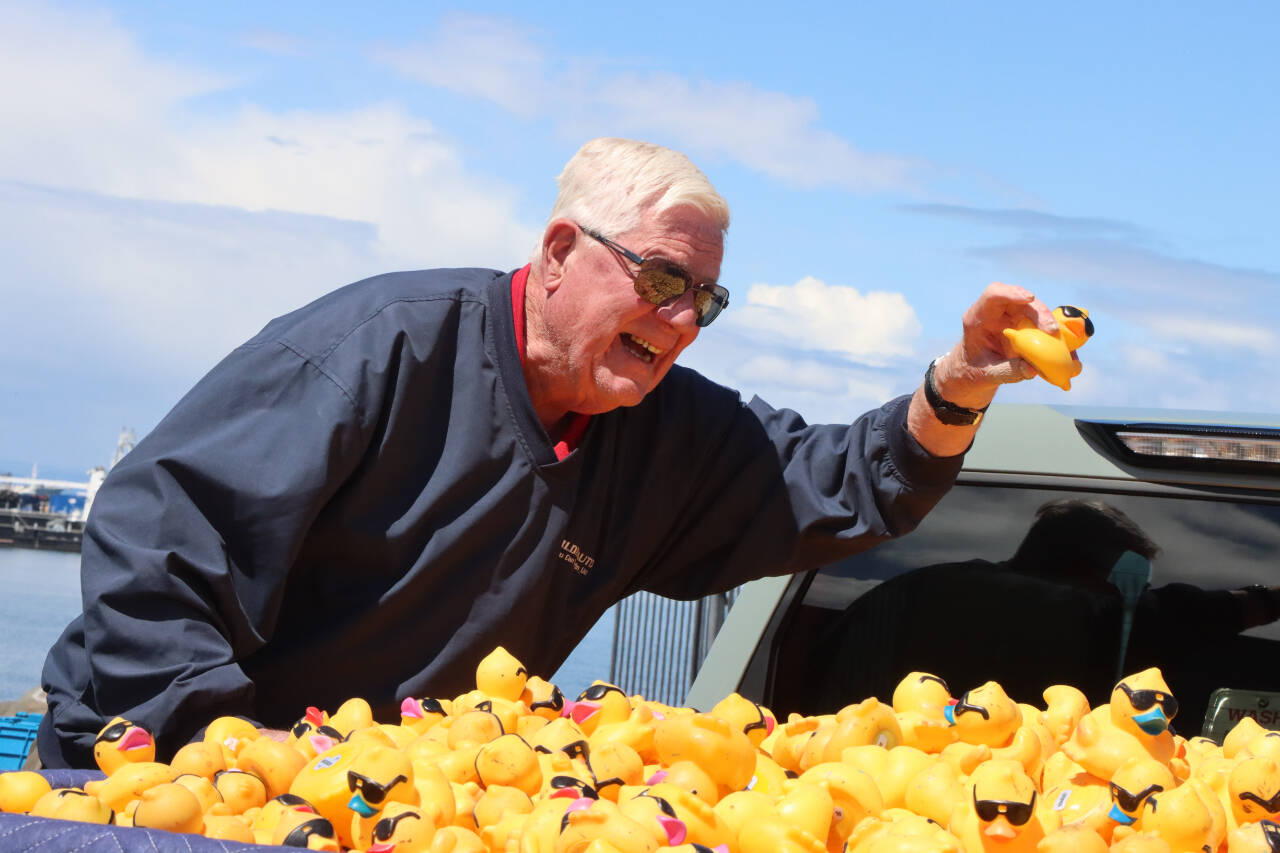 Gary Reidel, representing Wilder Toyota, plucks the winning duck from a truck. Wilder Toyota of Port Angeles sponsored the top prize of a 2024 Toyota Corolla. (Dave Logan/For Peninsula Daily News)