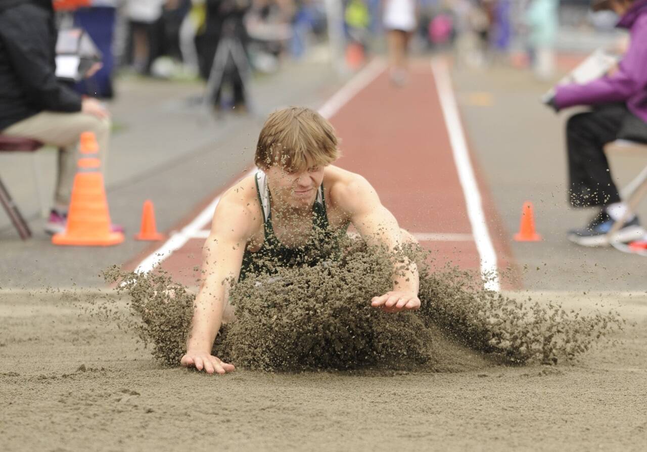 Port Angeles’ Parker Nickerson competes in the long jump this weekend at Mount Tahoma. (Michael Dashiell/Olympic Peninsula News Group)