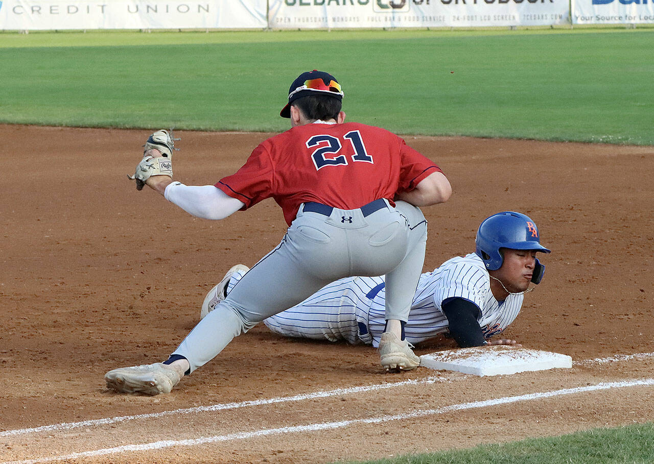 Lefties Roberto Nunez III returns safely to first base last summer at Civic Field in Port Angeles. Nunez, who hit .330 for Port Angeles last season, will return this year along with 9 other players. (Dave Logan/for Peninsula Daily News)