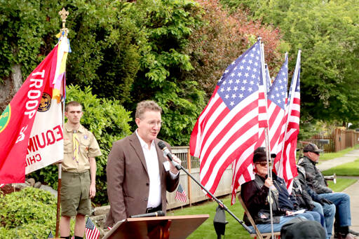 Lt. Comm. (Ret.) Doug Adams of the U.S. Navy served as the keynote speaker on Monday during the annual Memorial Day service at Captain Joseph House in Port Angeles. Adams, who now lives in Seattle, was at the same base in Afghanistan on May 29, 2011, when Capt. Joseph Schultz and others were killed. About 75 people attended the ceremony, which included a ceremony for Logan Hall, who died on July 13, 2018. His sister, Savannah Giddings, laid a special wreath to honor him. (Dave Logan/for Peninsula Daily News)