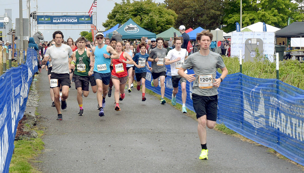 KEITH THORPE/PENINSULA DAILY NEWS Participants in the North Olympic Discovery Marathon OMC 5K/10K race take off from the start at Port Angeles City Pier on Saturday.