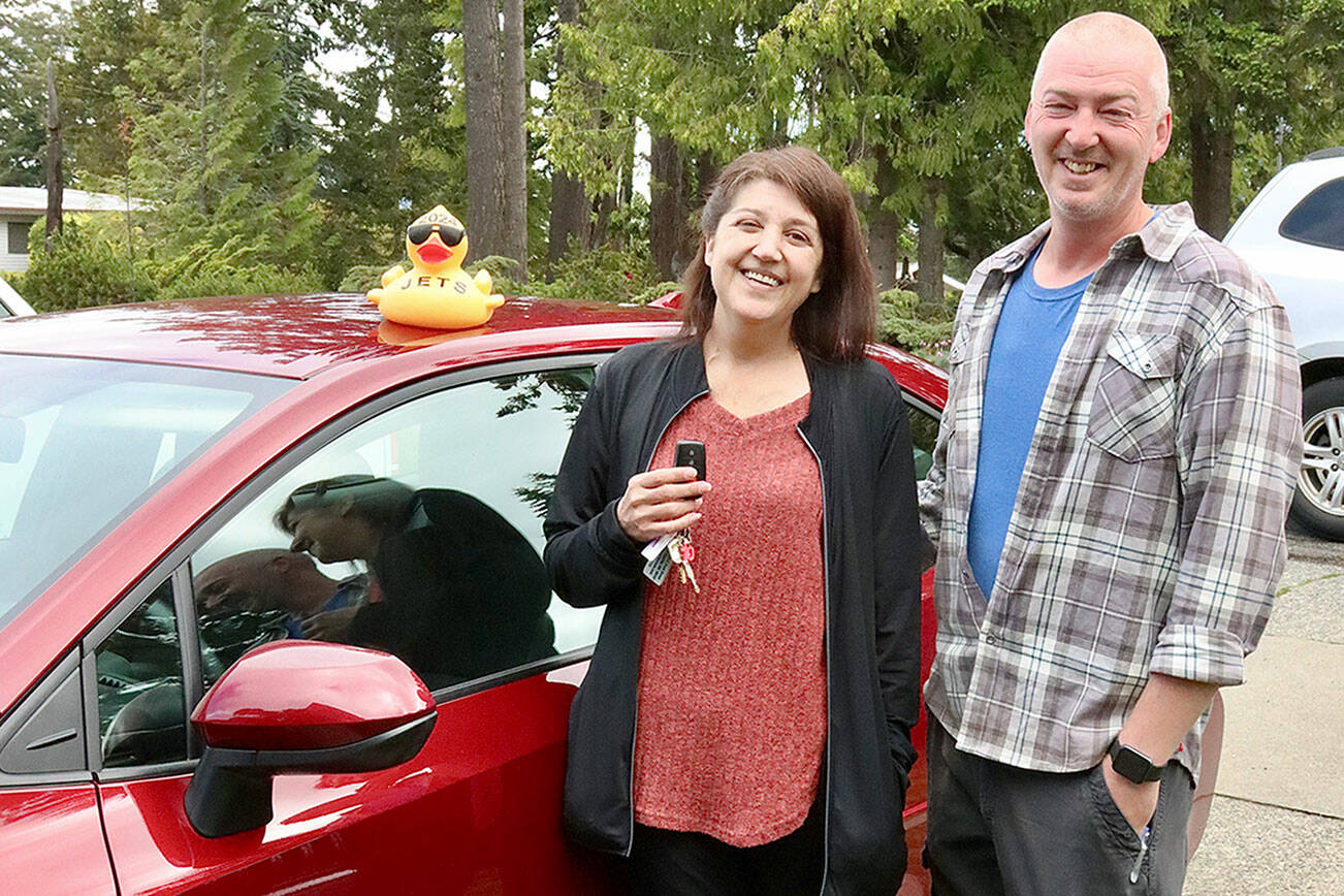 The 2024 Great Olympic Peninsula Duck Derby Winner(s) plural were John and Sarah Aten of Port Angeles. Their new 2024 Toyota Corolla from Wilder Auto in Ruby Red is a “nice treat” said John Aten. But his wife Sarah will drive it mostly as they have other autos in the family. Every year the family buys the big package for $350 which includes one entry in the VID race and 60 other duck entries in the main race of pluck a duck from a truck. Note that “their” VID duck is labeled JETS. The four letters stand for the four members of their family - John, Elora (a teen), Tim (also a teen) and Sarah. It's their family code, they often use. Sarah said this is all “so cool”. dlogan